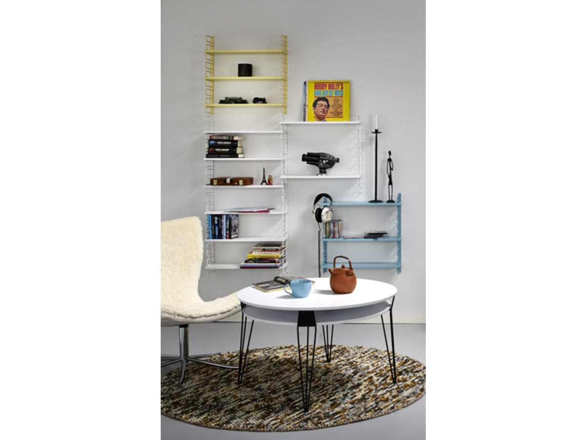 white round designer coffee table with black metal hairpin legs