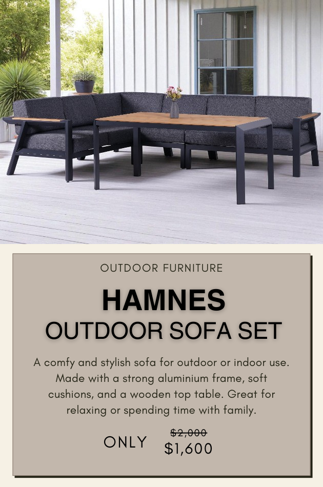 HAMNES outdoor sofa set with dark gray cushions and aluminum frame, includes wooden-top table on a patio deck.