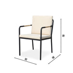 Hollviken outdoor dining chair with black metal frame, beige cushions, and wooden armrests on a modern patio deck.