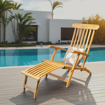 San Diego teak sun lounger by pool with cushion, palm trees, and luxury villa