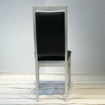 Landsort Dining Chair featuring a sleek, minimalist design with a sturdy wood frame and comfortable fabric upholstery, perfect for modern dining spaces.