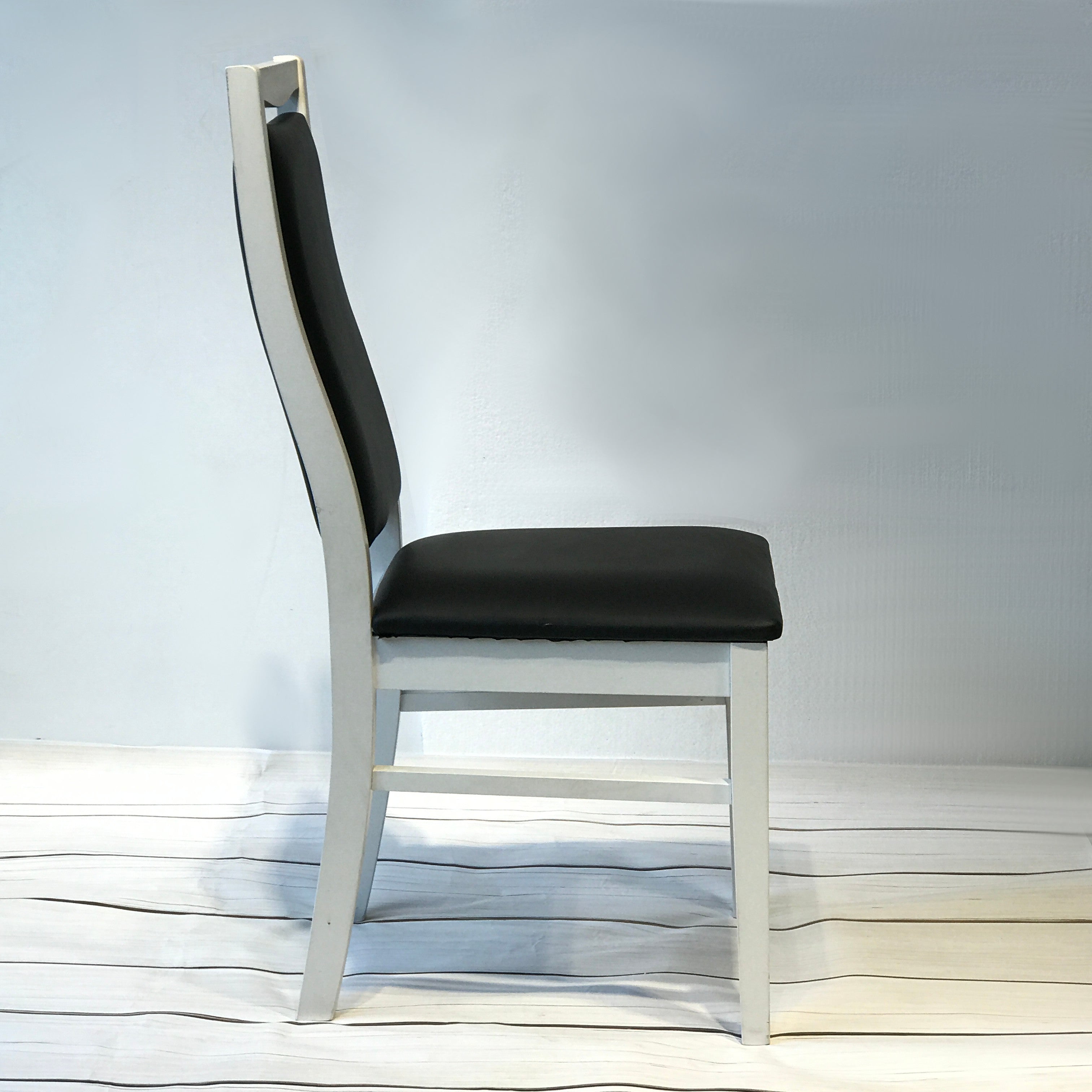 Landsort Dining Chair featuring a sleek, minimalist design with a sturdy wood frame and comfortable fabric upholstery, perfect for modern dining spaces.