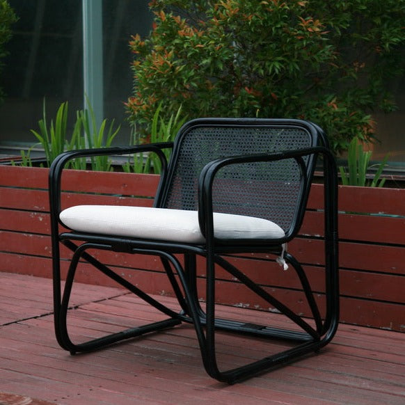 retro black rattan armchair