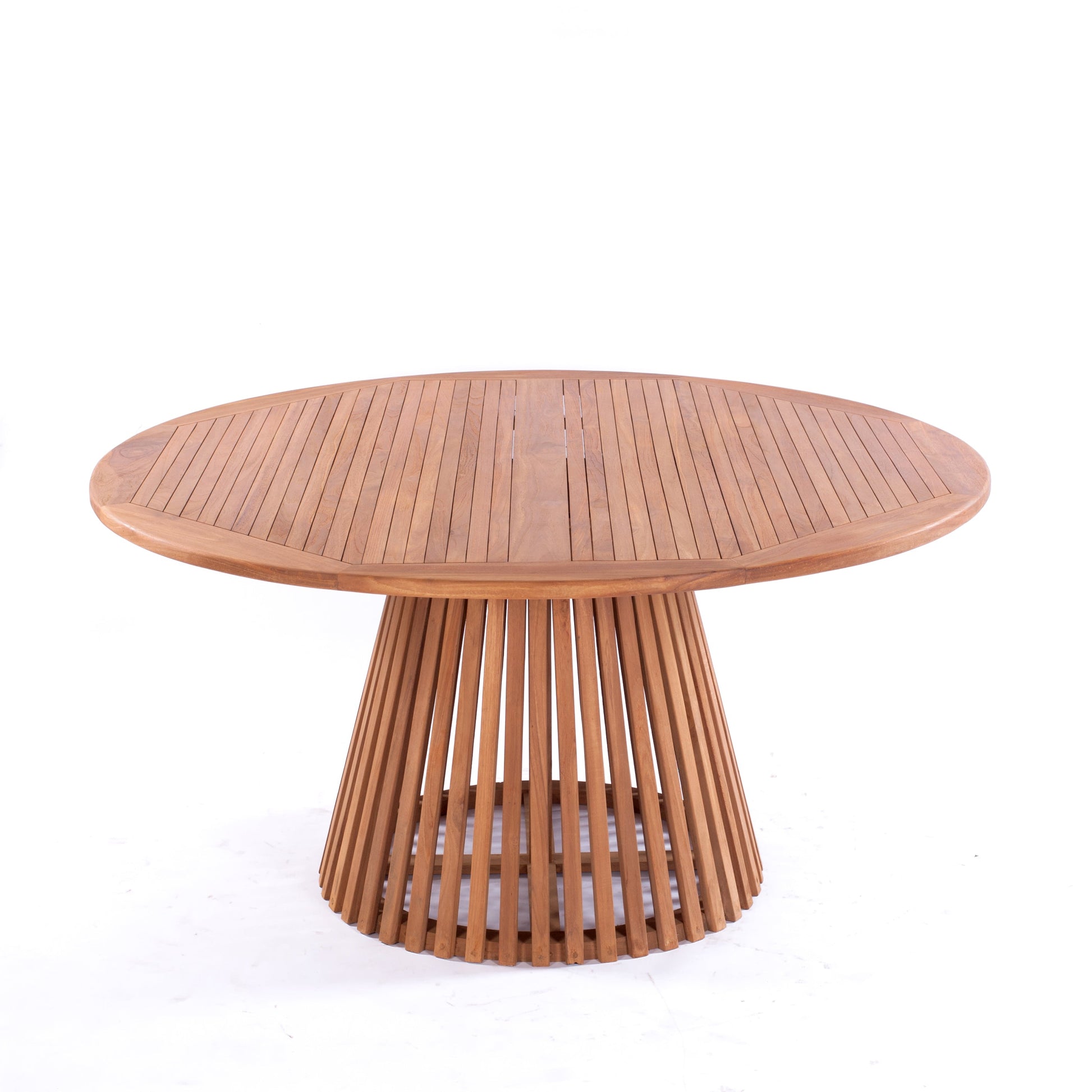 Nusa Dua round wooden outdoor dining table with slatted base, styled with white tableware and floral centerpiece on a garden patio deck.