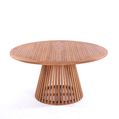 Nusa Dua round wooden outdoor dining table with slatted base, styled with white tableware and floral centerpiece on a garden patio deck.